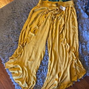 Ashley Stewart- Mustard colored swim pants. Ankle, flare pants.